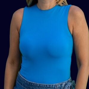 Authentic SKIMS bodysuit in a stunning blue, size M.